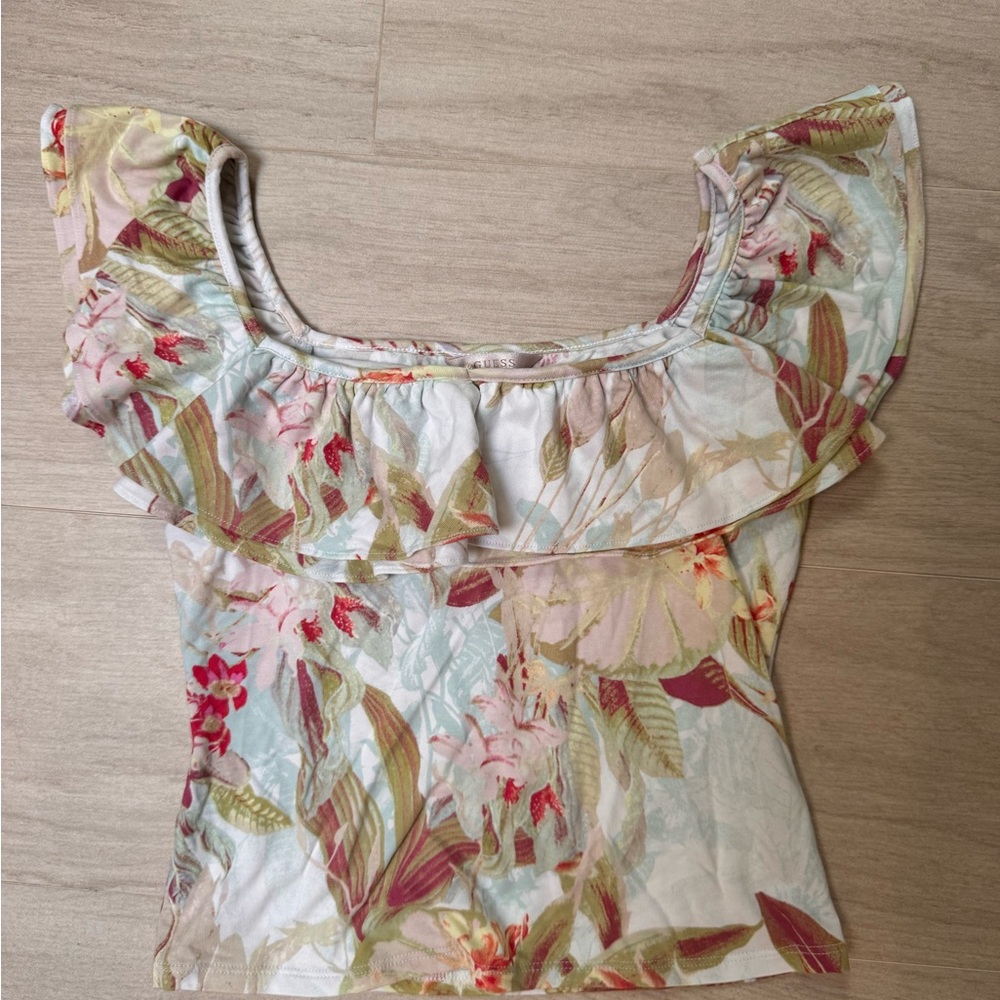 A blouse with soft, floral print with pastel tones, ruffled neckline. - Picture 2 of 5